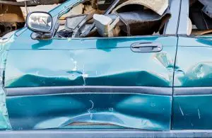 damaged car door due to auto accident
