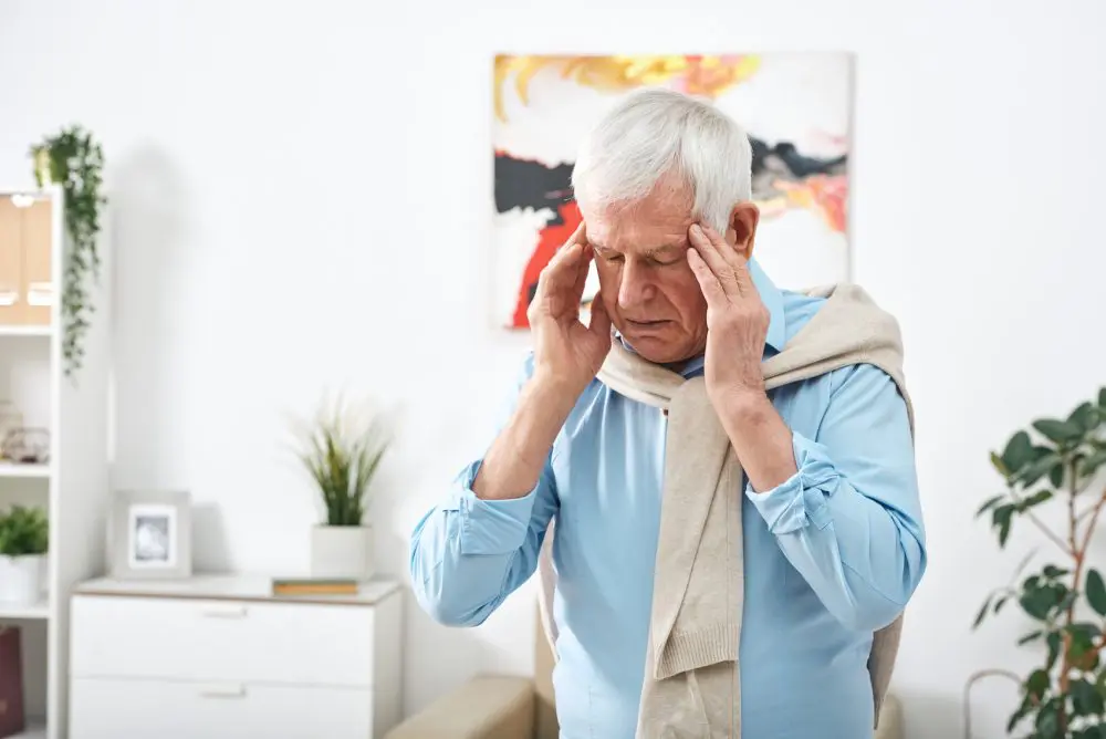 elderly man having a headache 