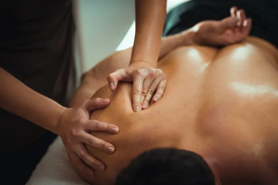 male patient receiving a professional massage shoulder pain treatment in fort wayne