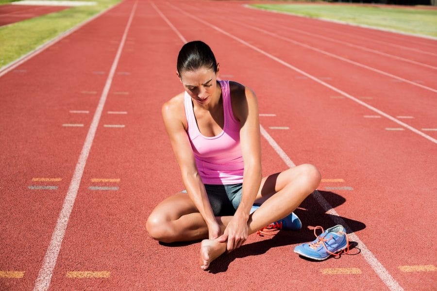 female athlete with leg pain
