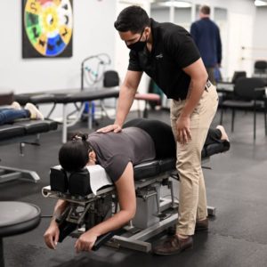 Chiropractor doing flexion distraction technique