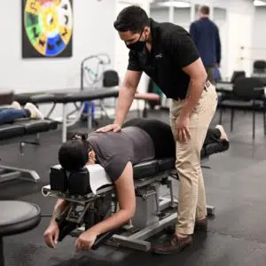 Chiropractor doing flexion distraction technique