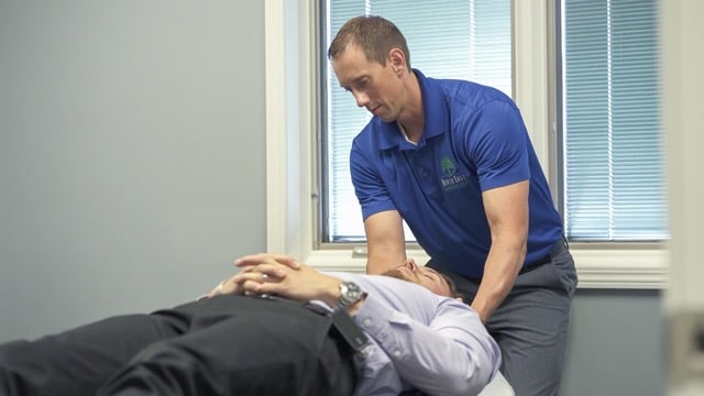 Chiropractor at North East Chiro Center is treating a patient with migraine 