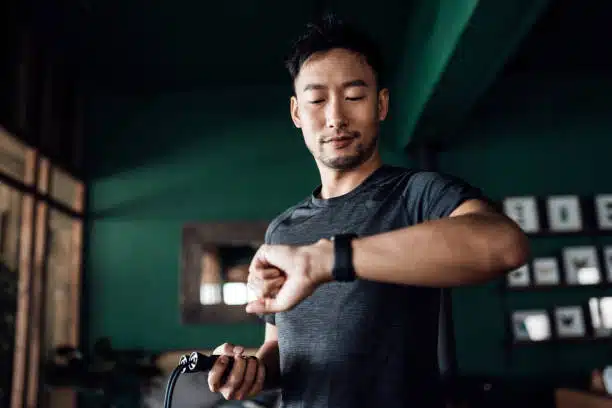 Active young Asian man exercising at home having a healthy mind and body.