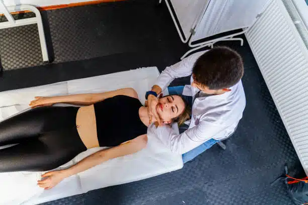 Chiropractor using chiropractic techniques for neck adjustments.