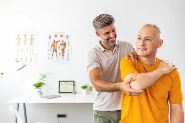 Physical therapists are checking patients elbows at the clinic.