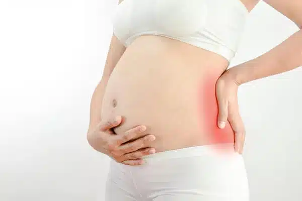 Woman suffers from sciatica During Pregnancy.