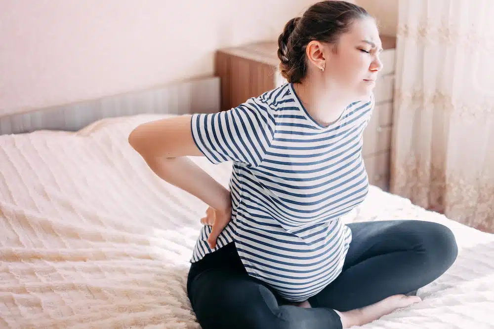 Woman suffers from sciatica During Pregnancy.