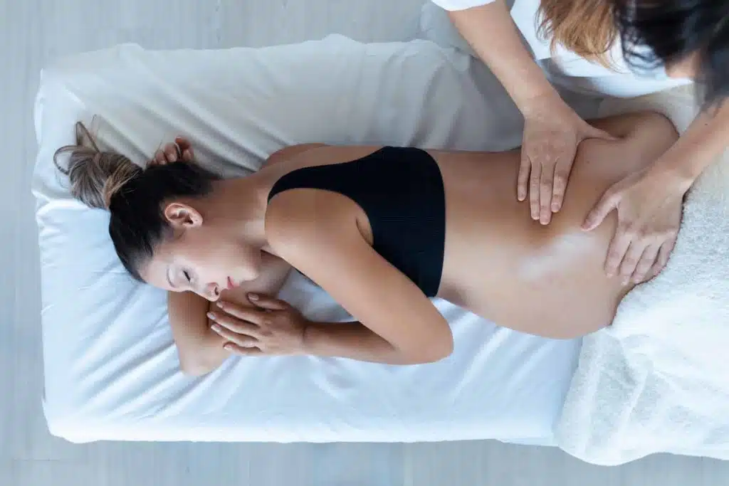 Pregnant woman having her prenatal chiropractic treatment at the clinic.