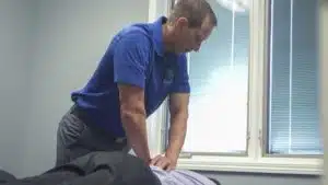 Dr. Adam Osenga performing a spinal decompression in Fort Wayne treatment at Nort East Chiropractic Center 