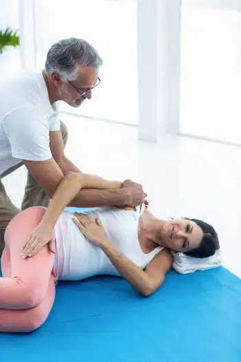 Pregnant woman receiving gentle chiropractic treatment for comfort and alignment