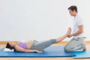 chiropractor helping pregnant woman prepare for labor and delivery with maintaining Proper Alignment