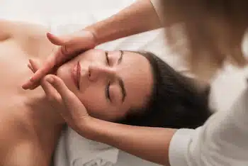 Masseuse doing massage to client for relaxation