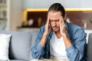 man having a headache needing headache and migraine treatment in fort wayne