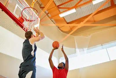 basketball player shooting a short-ranged shot | chiropractic routines for hoosier basketball teams