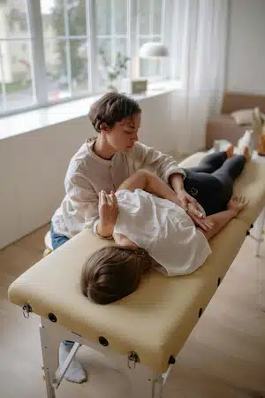 a patient performing for chiropractic care and spinal decompression for sports injury