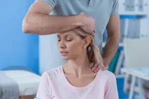 woman receiving Chiropractic Care and Massage Therapy 