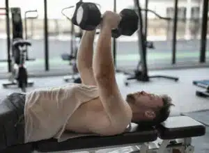 Man doing some sports and exercise in the fitness center