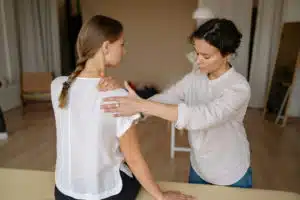 Shoulder chiropractic care adjustment in a chiropractic clinic