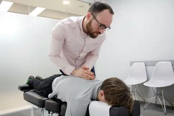 A man having a back chiropractic