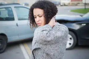 A woman experiencing a whiplash